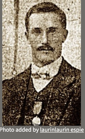 Original newspaper portrait of Herbert William Carter in a suit, waistcoat and bow tie