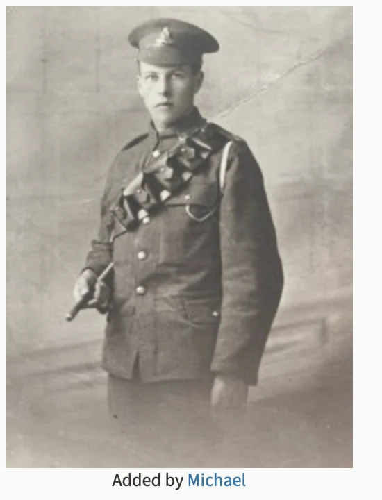 Frederick Pennell standing in uniform with a service cap and bandolier